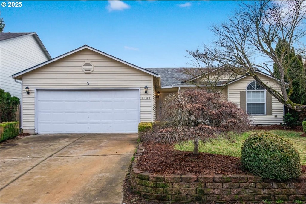 ranch-style home with a garage