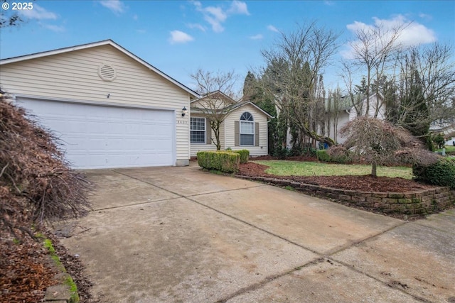 ranch-style house featuring a garage