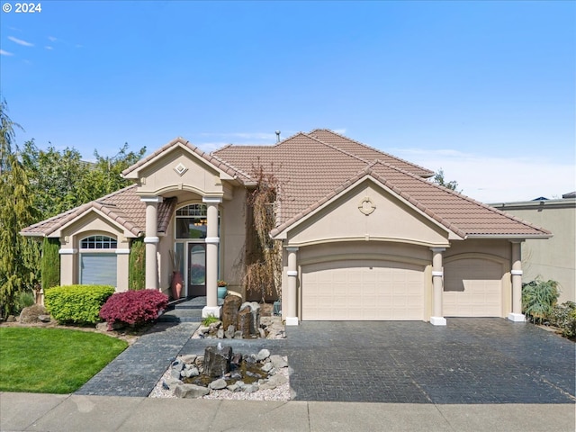 view of front of property with a garage