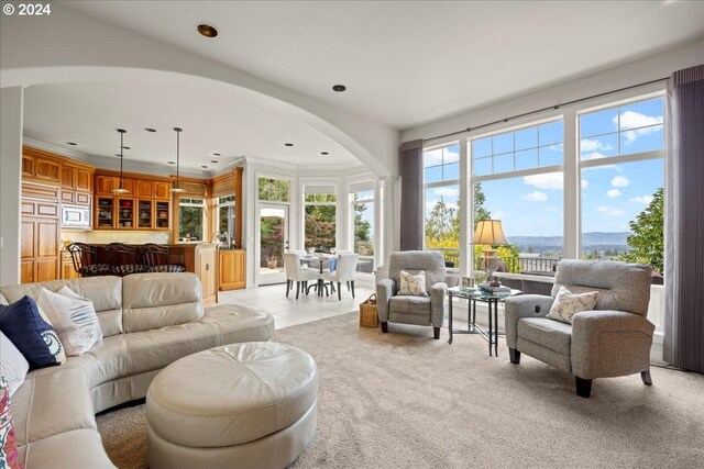 tiled living room featuring crown molding