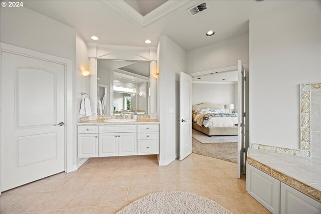 bathroom featuring tile patterned floors and vanity