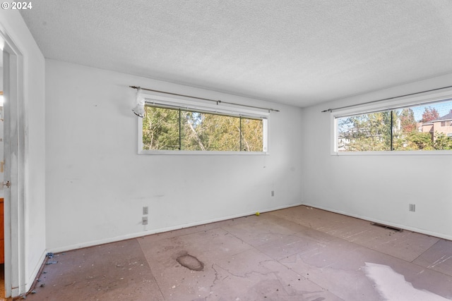 empty room with a textured ceiling