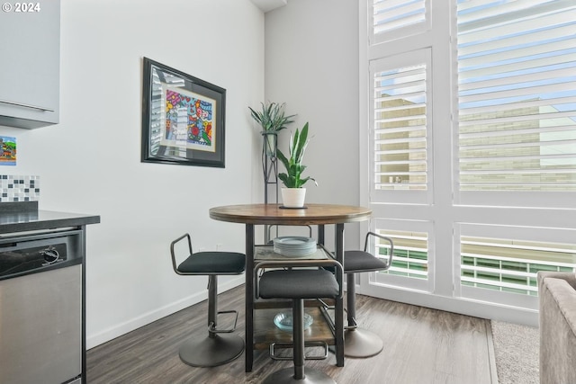 dining space featuring dark hardwood / wood-style floors