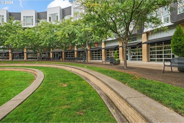 view of property's community with a lawn