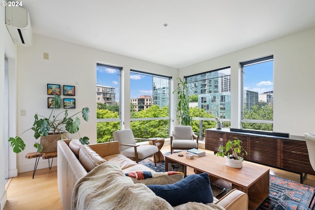 sunroom with a wall mounted air conditioner and a healthy amount of sunlight