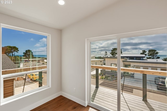 balcony featuring a water view