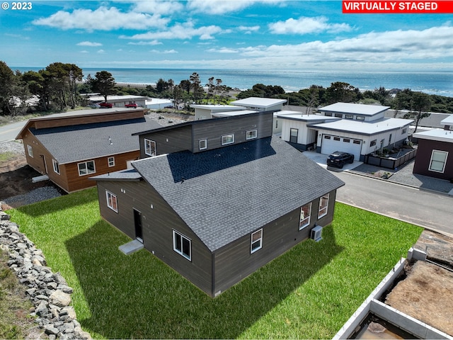 drone / aerial view with a water view