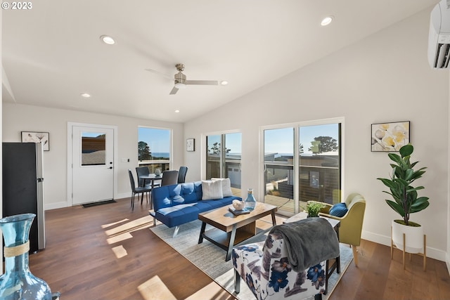 living room with a wall mounted air conditioner, vaulted ceiling, ceiling fan, and dark hardwood / wood-style flooring