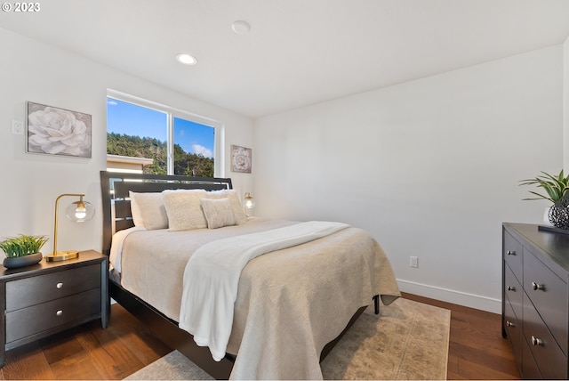 bedroom featuring dark hardwood / wood-style flooring