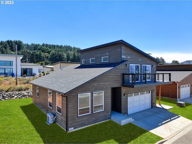 contemporary home featuring a front lawn and a garage