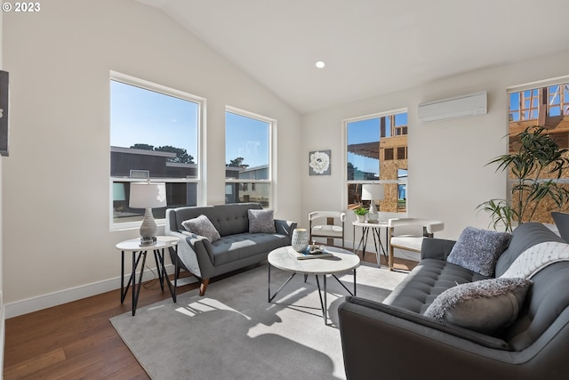 living room with lofted ceiling, a wall unit AC, and wood-type flooring