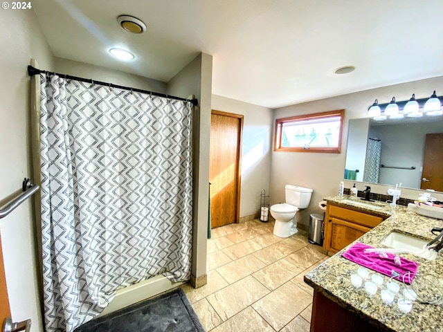 bathroom featuring vanity, toilet, and a shower with curtain