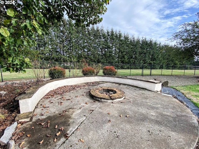 view of patio / terrace featuring a fire pit