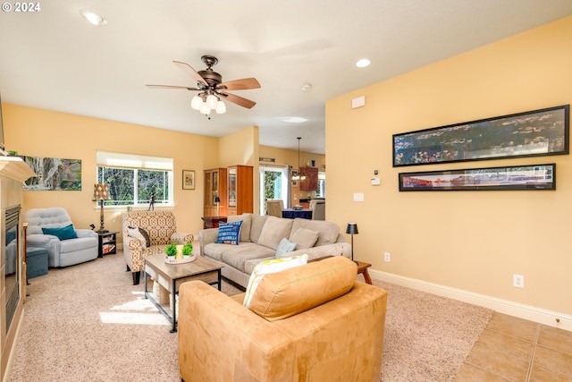 carpeted living room featuring ceiling fan