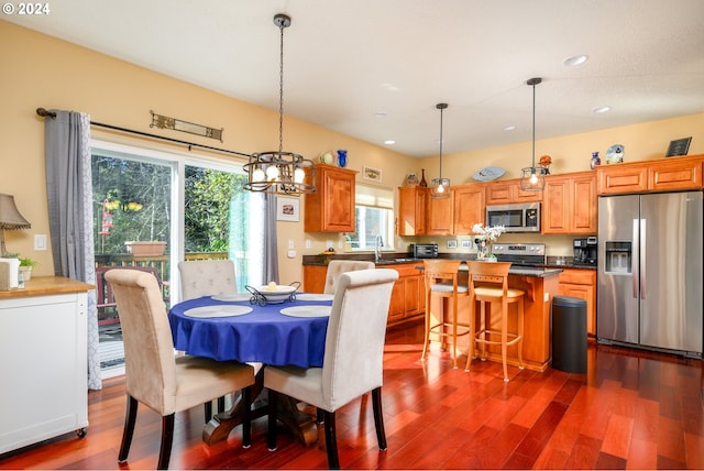 4505 NE Tide Ave, Lincoln City, OR 97367 - dining area featuring dark wood-type flooring, recessed lighting, and a chandelier