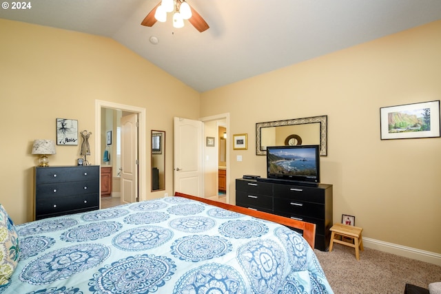 bedroom with ceiling fan, carpet, lofted ceiling, and ensuite bath