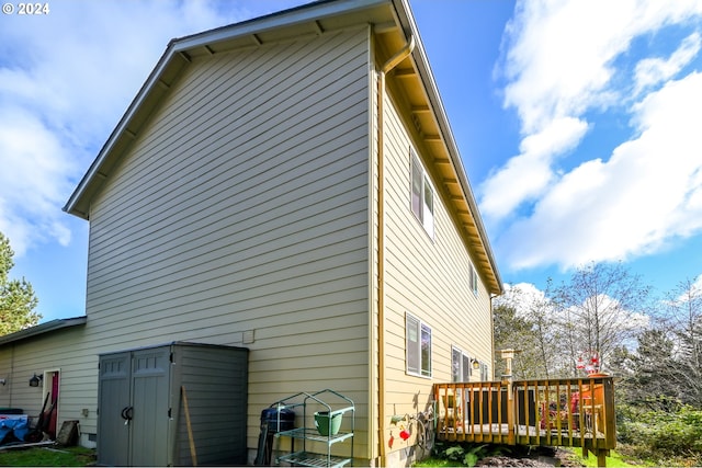 rear view of house featuring a deck