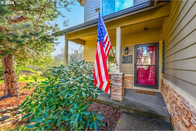 doorway to property with a porch