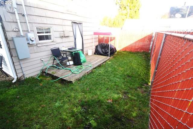 view of yard featuring a wooden deck