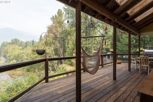 deck featuring a mountain view and a grill