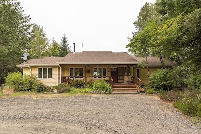 ranch-style house with covered porch