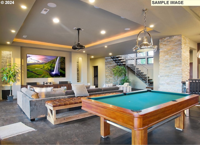 rec room featuring billiards, a tray ceiling, and ornate columns