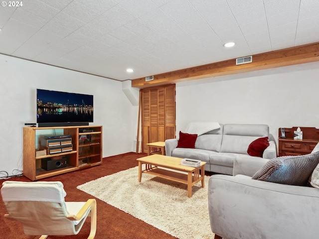 carpeted living room with visible vents and recessed lighting