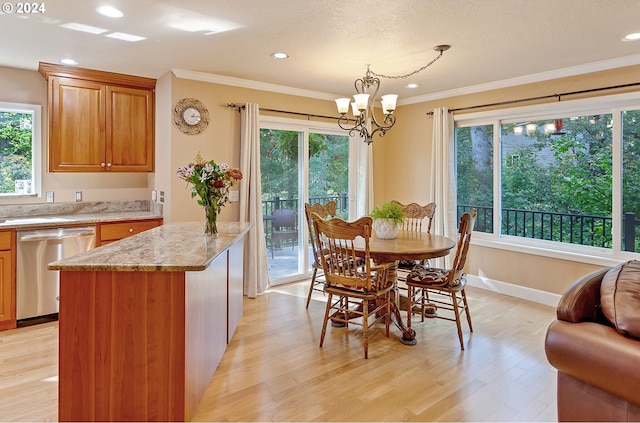 interior space featuring light hardwood / wood-style floors, an inviting chandelier, and crown molding