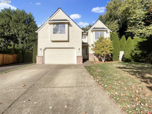 16193 NW Ryegrass St, Portland, OR 97229 - traditional-style home featuring a garage, fence, concrete driveway, and brick siding