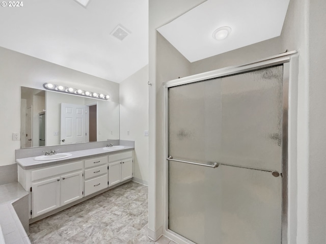 bathroom featuring vanity and an enclosed shower