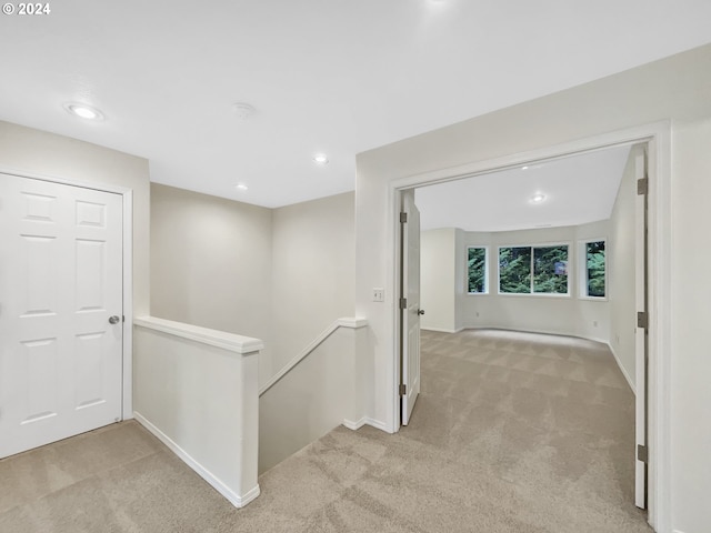 16193 NW Ryegrass St, Portland, OR 97229 - corridor with recessed lighting, baseboards, light carpet, and an upstairs landing