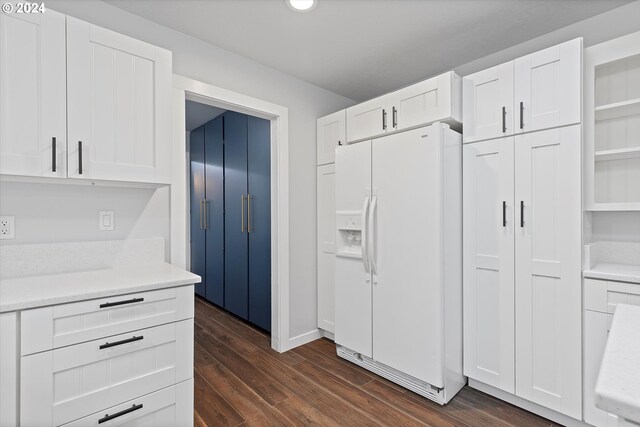 3735 NE Surf Dr, Lincoln City, OR 97367 - kitchen with white fridge with ice dispenser, white cabinets, dark wood-type flooring, light countertops, and recessed lighting