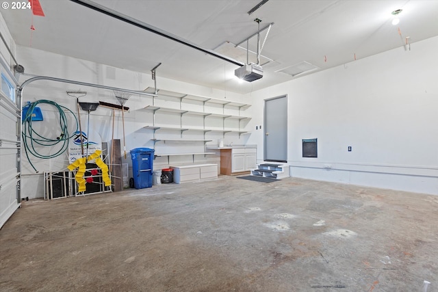 3735 NE Surf Dr, Lincoln City, OR 97367 - garage featuring a garage door opener