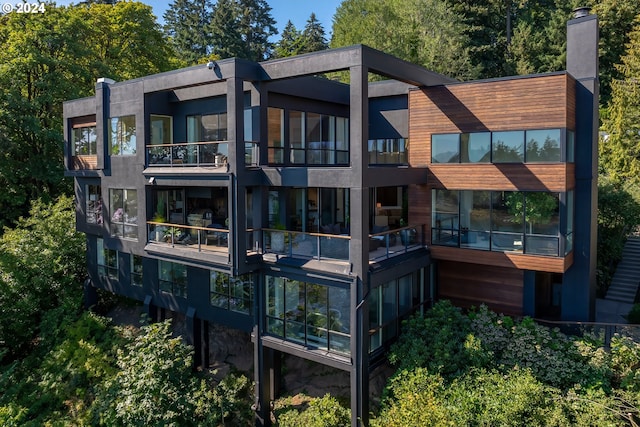 rear view of property with a balcony