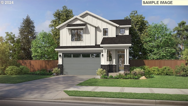 view of front of property with a garage and a front yard