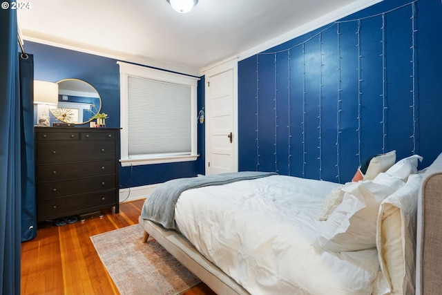 bedroom with hardwood / wood-style flooring