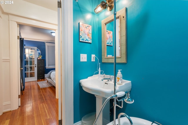 bathroom with wood-type flooring