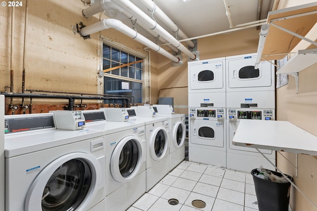 laundry room featuring washing machine and clothes dryer and stacked washer / dryer