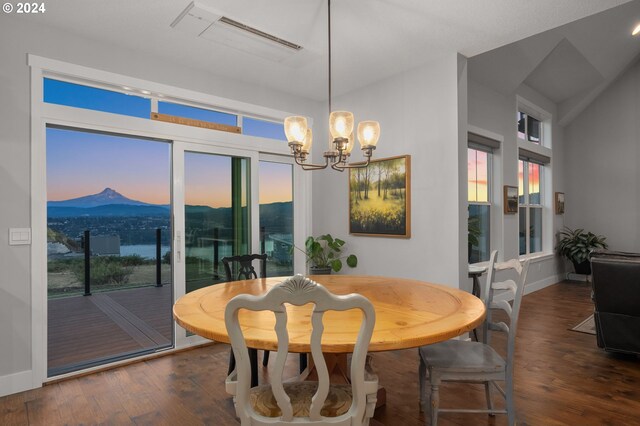 201 Sterling Blvd, White Salmon, WA 98672 - dining room featuring baseboards, wood finished floors, visible vents, and a chandelier