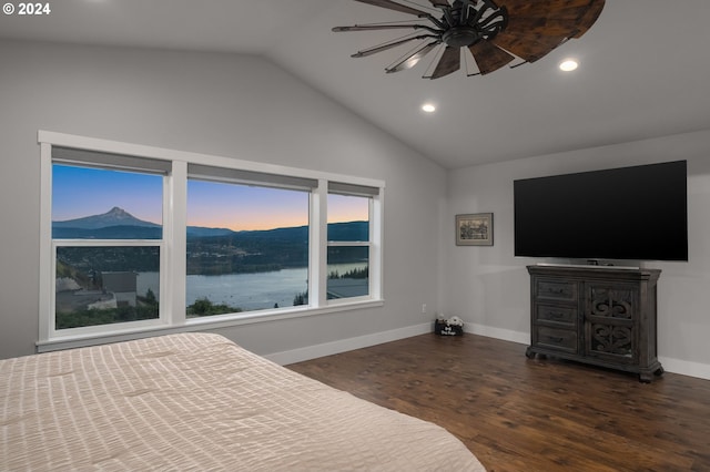 unfurnished bedroom featuring lofted ceiling, ceiling fan, and dark hardwood / wood-style floors