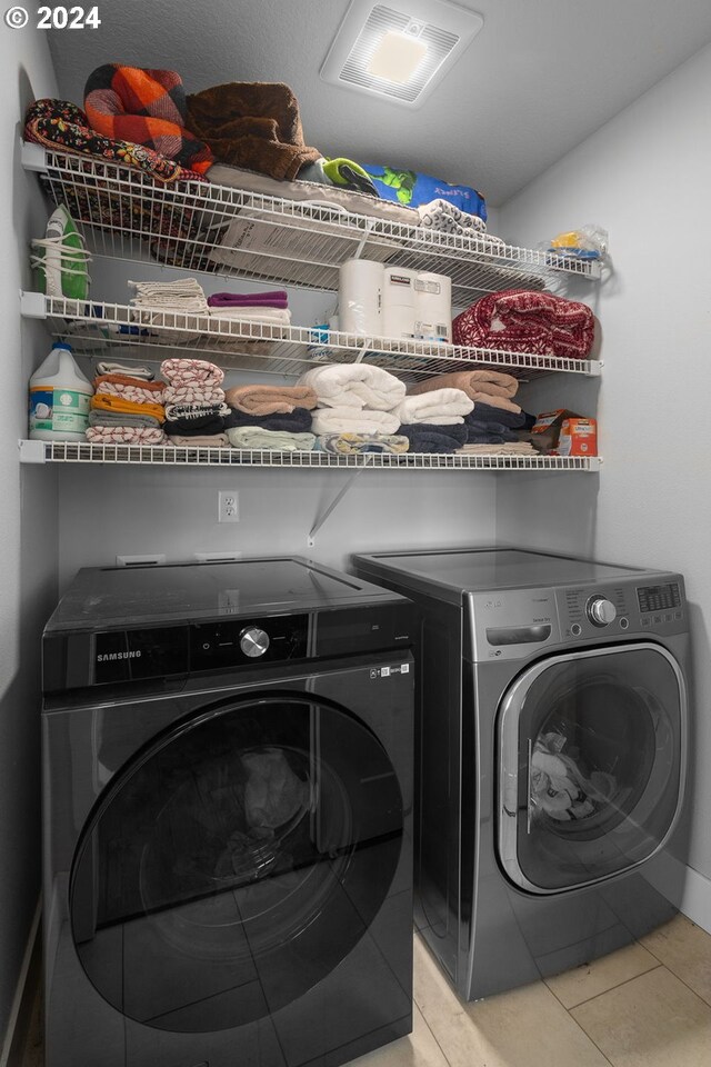 201 Sterling Blvd, White Salmon, WA 98672 - clothes washing area with tile patterned floors, laundry area, washer and dryer, and visible vents