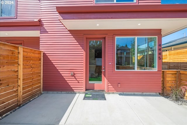 property entrance featuring a patio