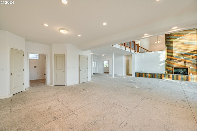 spare room featuring a fireplace