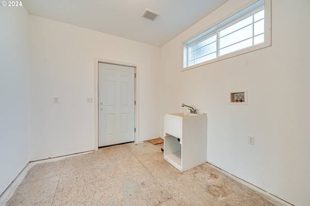 laundry room with hookup for a washing machine and sink