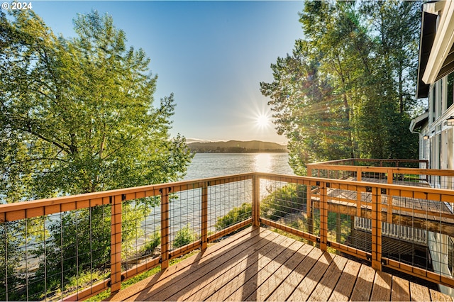 wooden deck with a water view