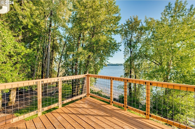 wooden terrace with a water view