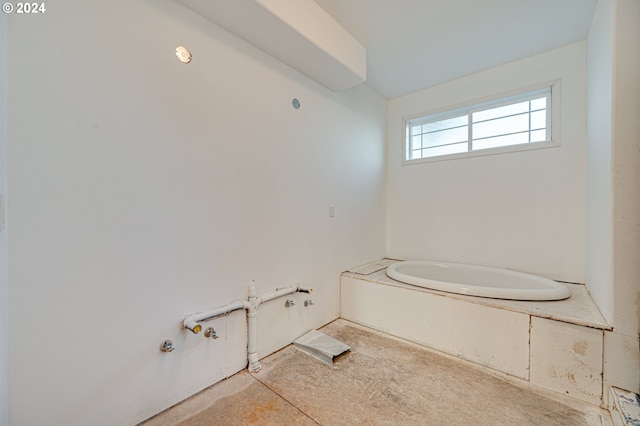 bathroom featuring a washtub