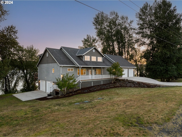 view of front facade with a lawn and a porch