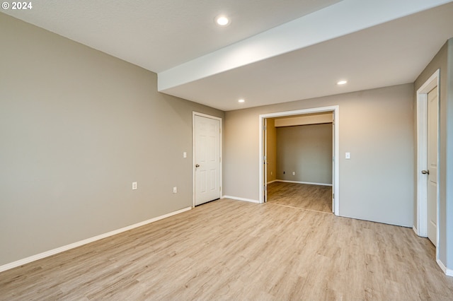 spare room with light hardwood / wood-style flooring