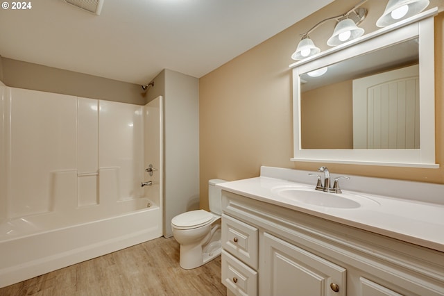 full bathroom with shower / bathing tub combination, vanity, toilet, and wood-type flooring